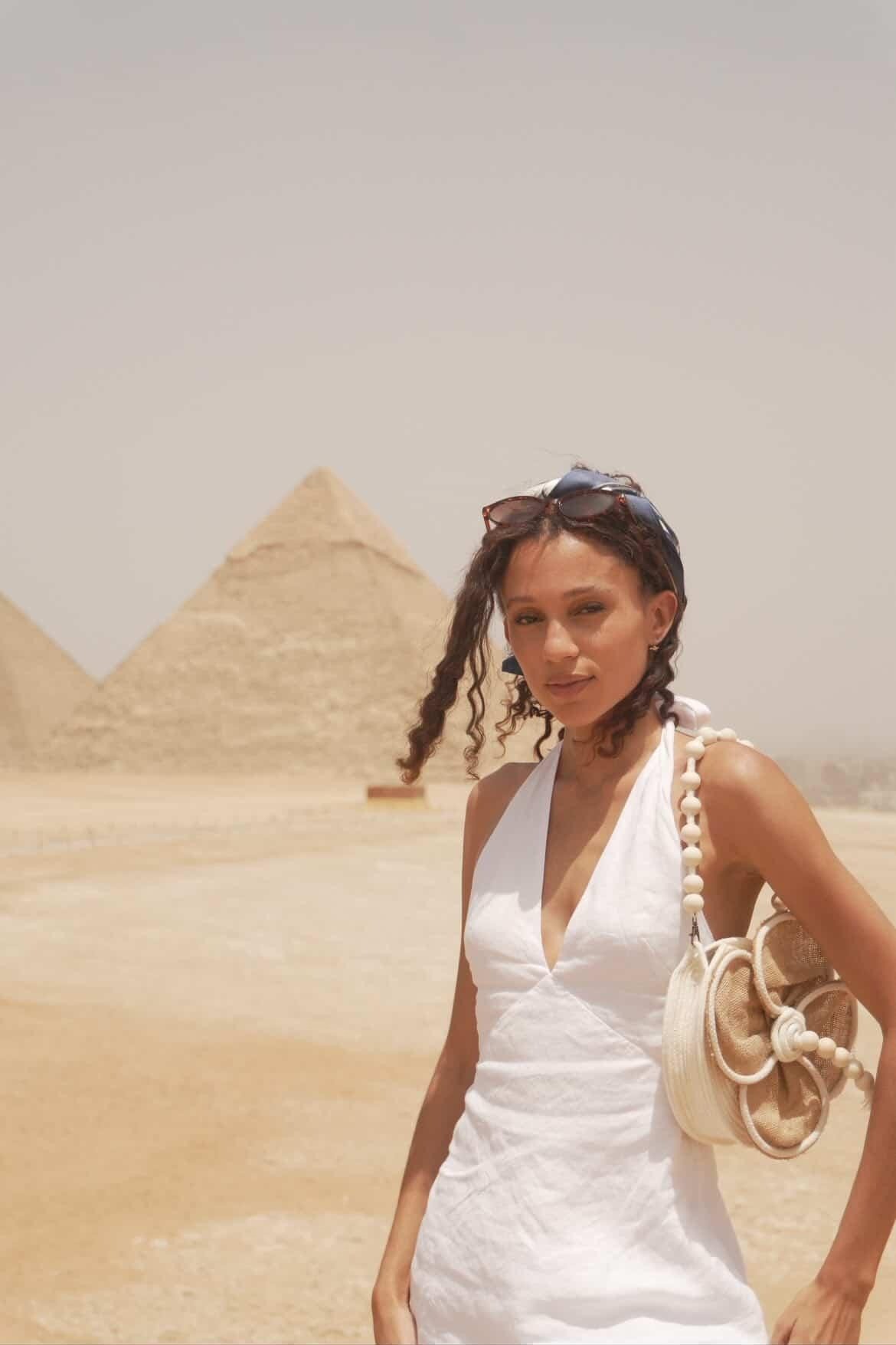 Miss Jamaica Eco international.  Wearing our Kari-Bloome bag next to the pyramids of Giza.   All Handcrafted Luxury Statement Pieces.  Crafted in the Caribbean.